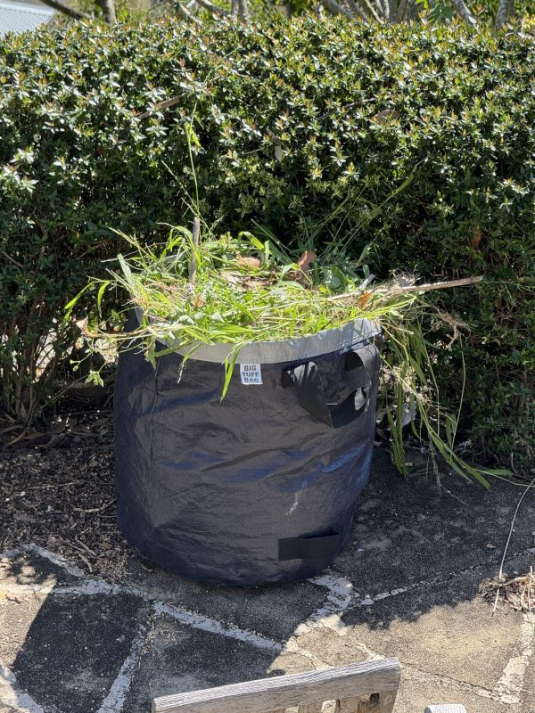 115 L Big Tuff Bag filled with garden clippings standing upright outdoors